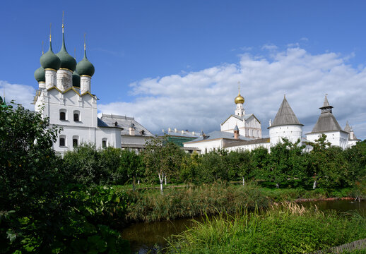 Metropolitan Garden with pond and apple trees and the Church of St. Gregory the Theologian of the 17th century in the Kremlin in Rostov the Great