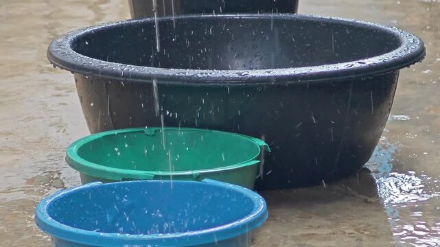 Villagers collecting rainwater to cope with water scarcity.