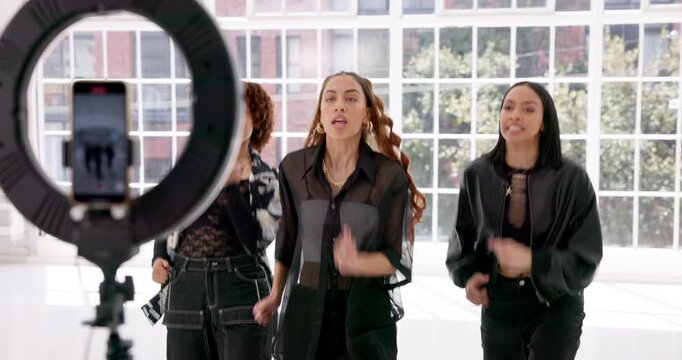 Happy, friends or women with ring light for dancing in studio with live streaming, social media challenge or energy. Girls, dancer or influencer filming a online hip hop tutorial for content creation