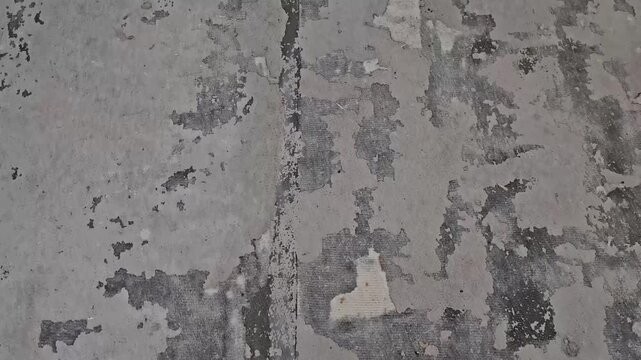 Exploring old concrete patterns on city streets during a sunny afternoon in downtown area