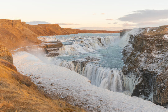 Frozen Gullfoss Waterfall at Sunset in Winter