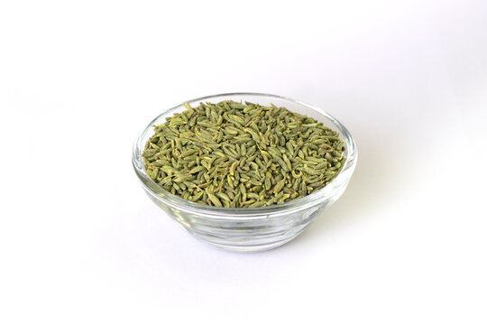 fennel seeds - saunf variyali in small glass bowl isolated on white background