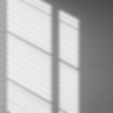 Shadow from window overlay natural ligh effect on white gray background. Gritty, grainy silhouette light abstract for wallpaper minimal, mock up design. Blurred image noise backdrop.  Black and white