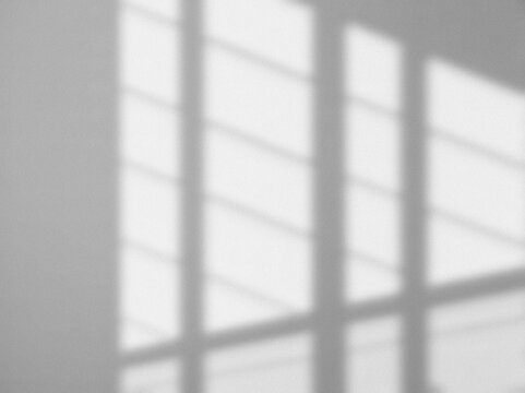 Shadow from window overlay natural ligh effect on white gray background. Gritty, grainy silhouette light abstract for wallpaper minimal, mock up design. Blurred image noise backdrop.  Black and white