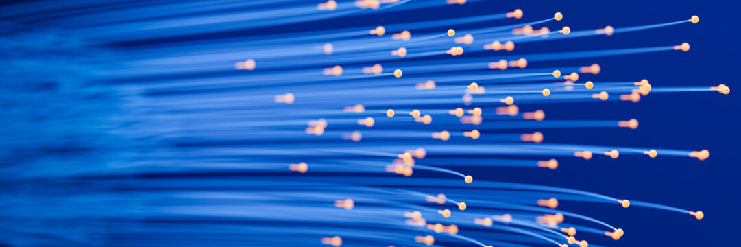 Abstract Fiber Optics: Glowing BlAbstract Fiber Optics: Glowing Blue Data Streams and Digital Networks. Selective focus