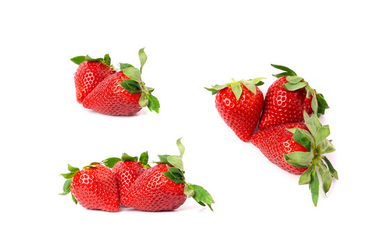 Fresh strawberry pile isolated, whole ripe straw berries, red juicy imperfect strawberri