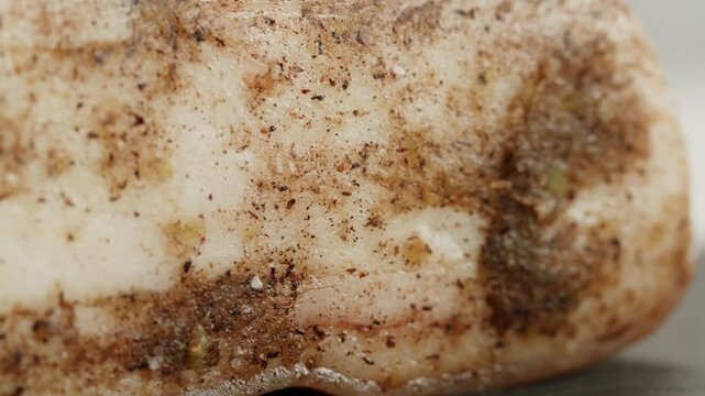 Salted lard bacon pork meat slicing in restaurant on kitchen, salo macro pork fat, black bread sandwich decorated with dill on white background close-up. Healthy fats. Healthy food. Vitamins