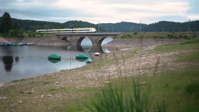 Train passing stone Bridge in Schluchsee Blackforest Germany