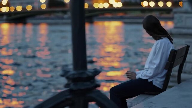 Jesus Christ sits with a reflective person at dusk by a river as a written intention turns contemplation into forward movement. City-light water reflections and notebook close-ups create