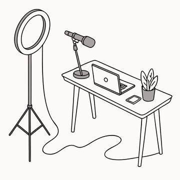 A desk with a laptop computer and a microphone