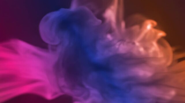Abstract colorful smoke swirls and waves in motion with vibrant gradient lighting