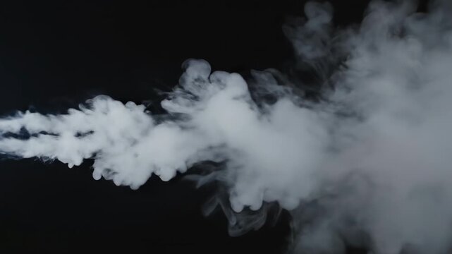 Wisps of white smoke swirling and dissipating against a dark background