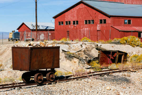 Tonopah, Nevada, USA Red mining buildings and rusted cart in desert ghost town
