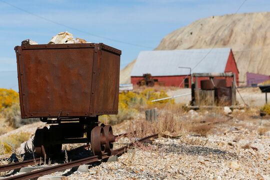 Tonopah, Nevada, USA Rusted mining cart and buildings in desert ghost town landscape