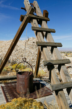 Tonopah, Nevada, USA Old mining ladder and bucket in desert ghost town mining site