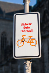 Fototapeta premium Sign with the german text Sichere dein Fahrrad. Translation: Lock up your bike