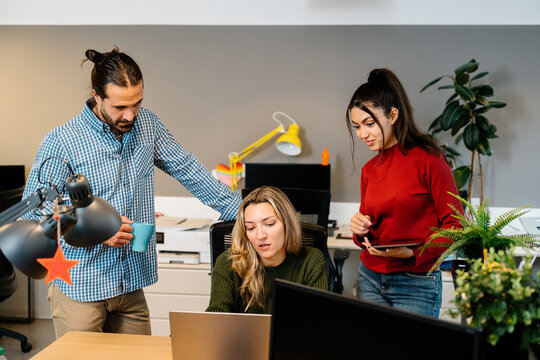 Office teamwork among colleagues with technology