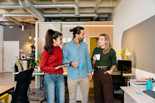 Colleagues having a casual chat in the office