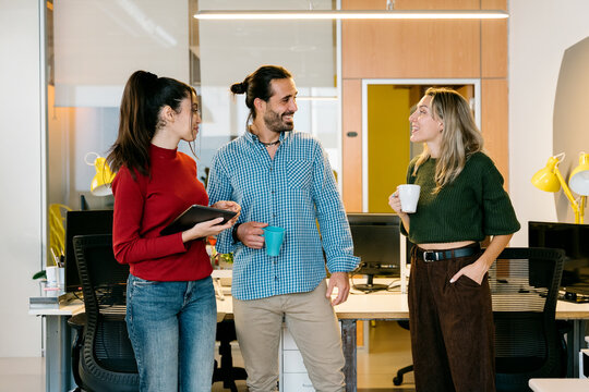 Colleagues having a casual chat in the office