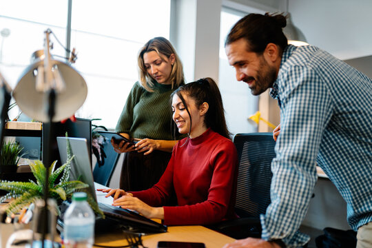 Collaborative team working in modern office space