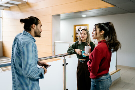 Colleagues engaging in a casual office chat