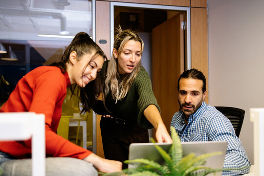 Coworkers collaborating in a modern office setting