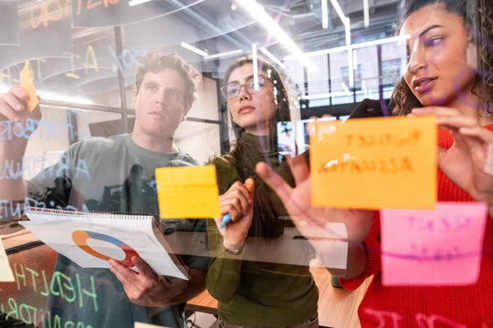 Brainstorming session with diverse team in coworking space