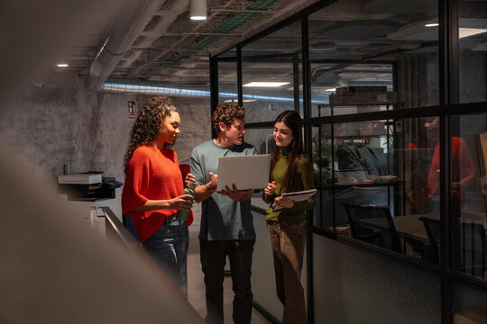 Multiethnic team meeting in modern coworking space