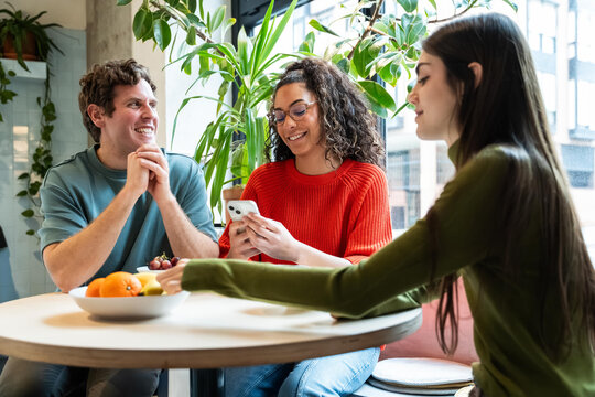 Multiethnic team collaborating in a bright coworking space