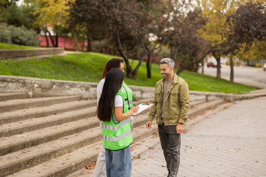 Friends discussing eco projects in the city outdoors