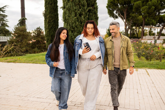 Multiethnic friends enjoying a city stroll together