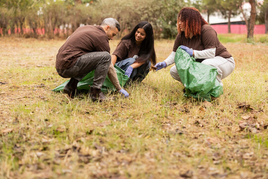 Friends volunteering in an eco clean-up activity