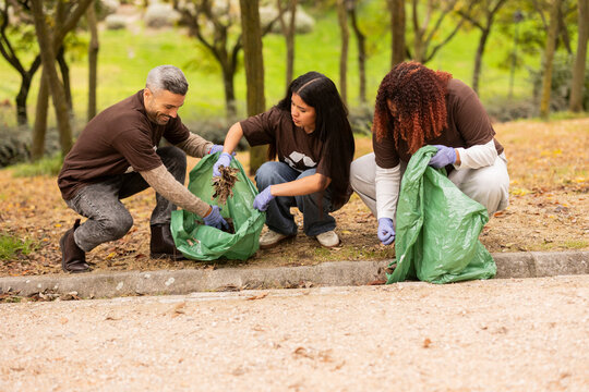 Multiethnic friends participating in city cleanup