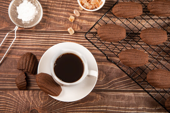 Chocolate madeleines with coffee and sugar