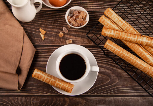 Coffee with wafer roll cookies and ingredients