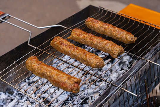 Grilled kofta kebabs over charcoal grill barbecue