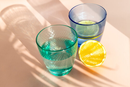 Refreshing citrus water in colorful glassware