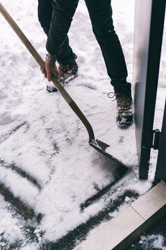 Shoveling snow on urban street during winter cleanup