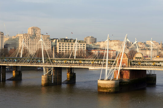 London skyline with modern bridge over the Thames