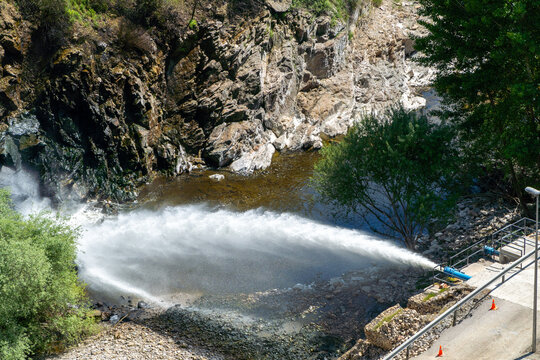 Hydroelectric dam water discharge generating renewable energy