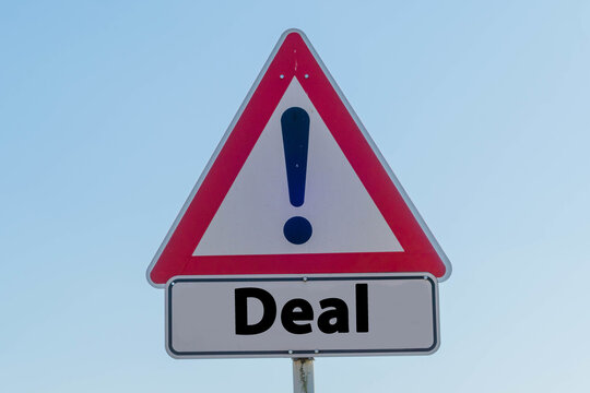 Caution Sign with Word Deal