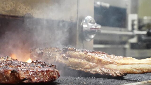 Cooking Tomahawk Steak. Premium Meat Preparation. Video of tomahawk steak cooking with high heat and rich texture.