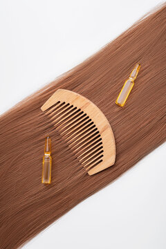 Wooden comb with hair serum for strong hair care
