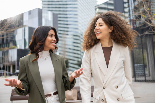Women discussing business in an urban setting