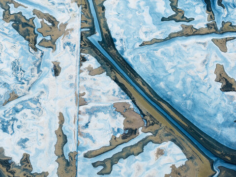 Aerial view of an abstract icy landscape pattern