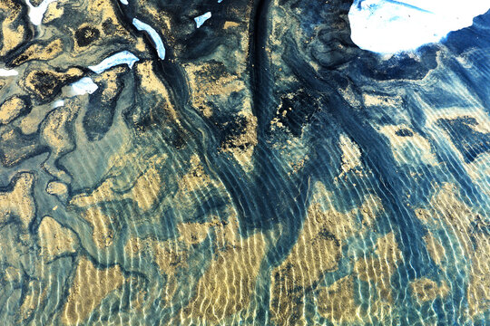 Sand and water abstract pattern during low tide