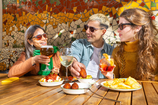 Enjoying tapas and drinks with friends