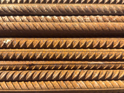 Rusted steel rebar texture close-up in sunlight