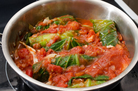 Cabbage rolls simmering in tomato sauce