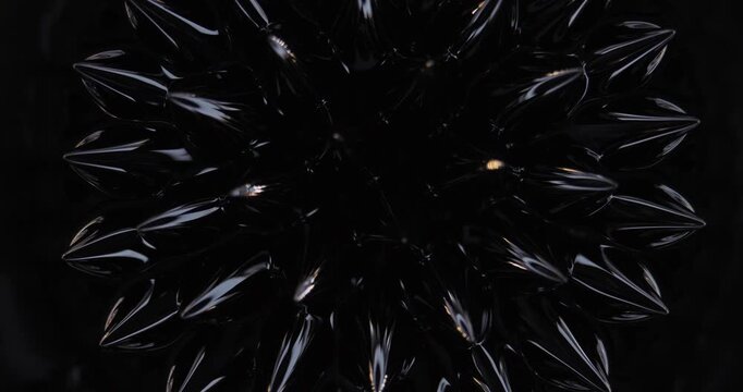 Magnetic fluid. Ferrofluid. Black liquid surface. Abstract background.